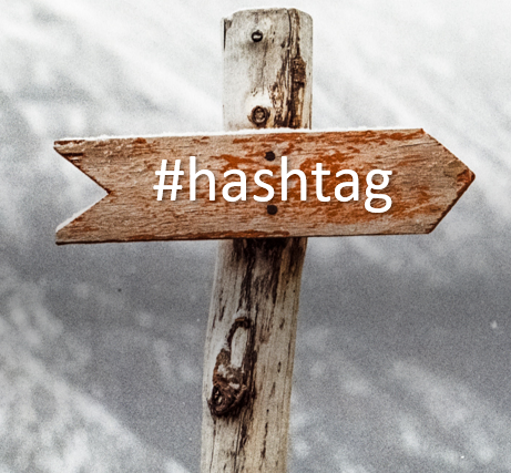 E-BUSINESS & E-MARKETING includes cross like sign with #hashtag