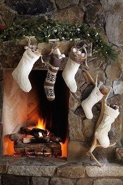 Stockings are hung by the fireplace