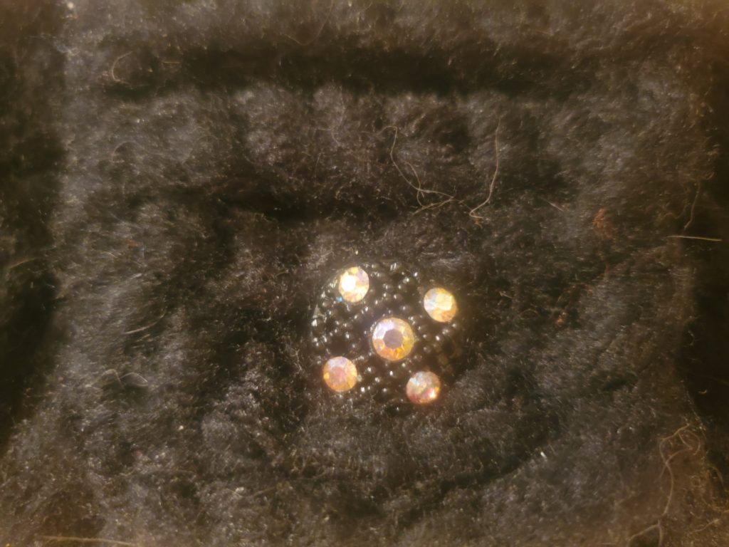 Black button with 5 rhinestones used on the Black Clutch Purse.